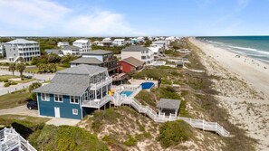 A coastal residential area with houses, a beach, and a clear sky. - Dog-friendly 5BR Beach Home with Pool & Ocean Views (Emerald Isle)