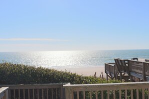 A wooden deck overlooking a beach with a clear view of the ocean. - Oceanfront 4BR Escape with Hot Tub & Deck Views (Emerald Isle)