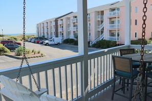 Outdoor dining - 3BR Condo with Deck, Pool & Easy Beach Access (Emerald Isle)