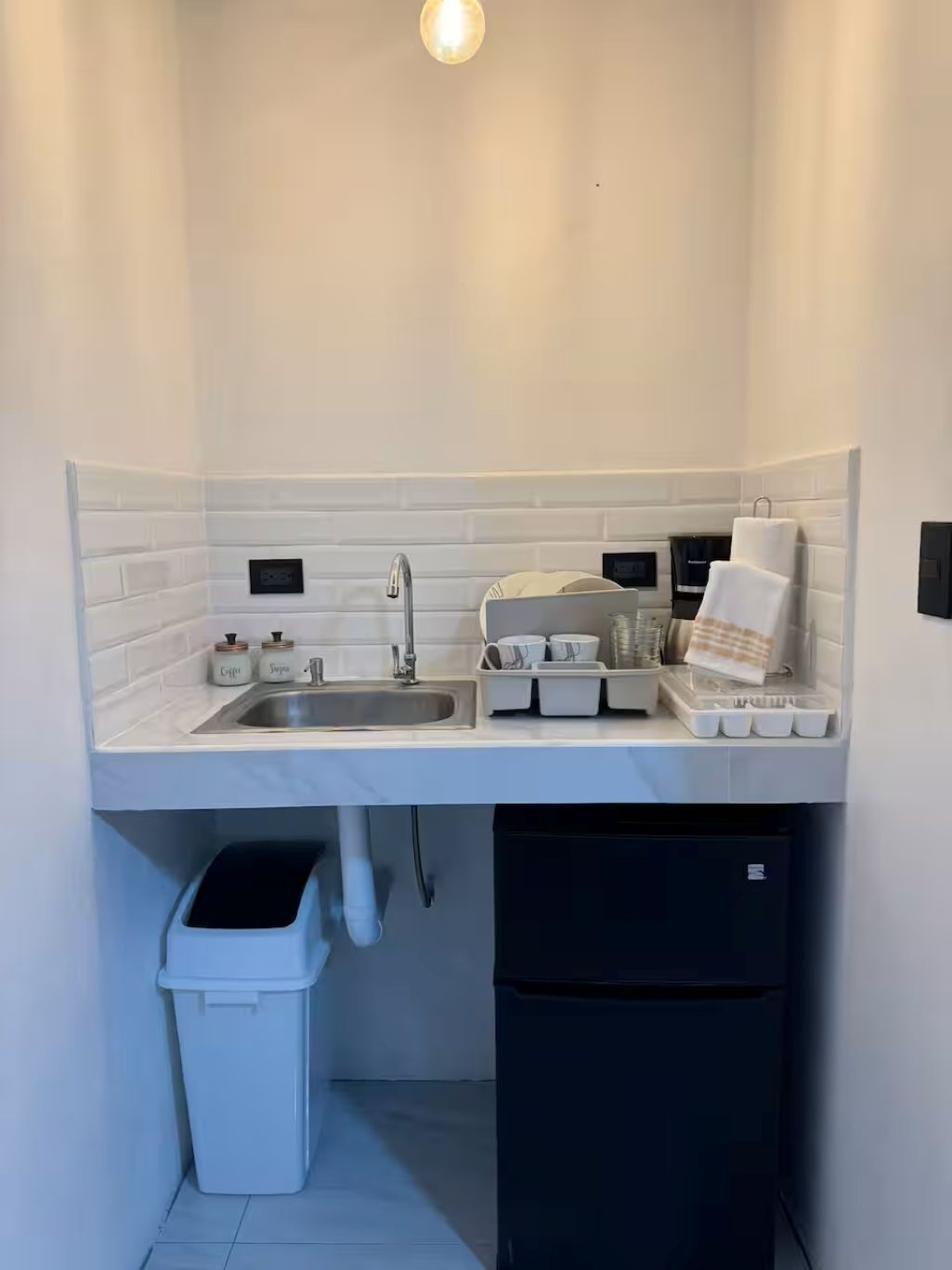 Fridge, microwave, coffee/tea maker, cookware/dishes/utensils