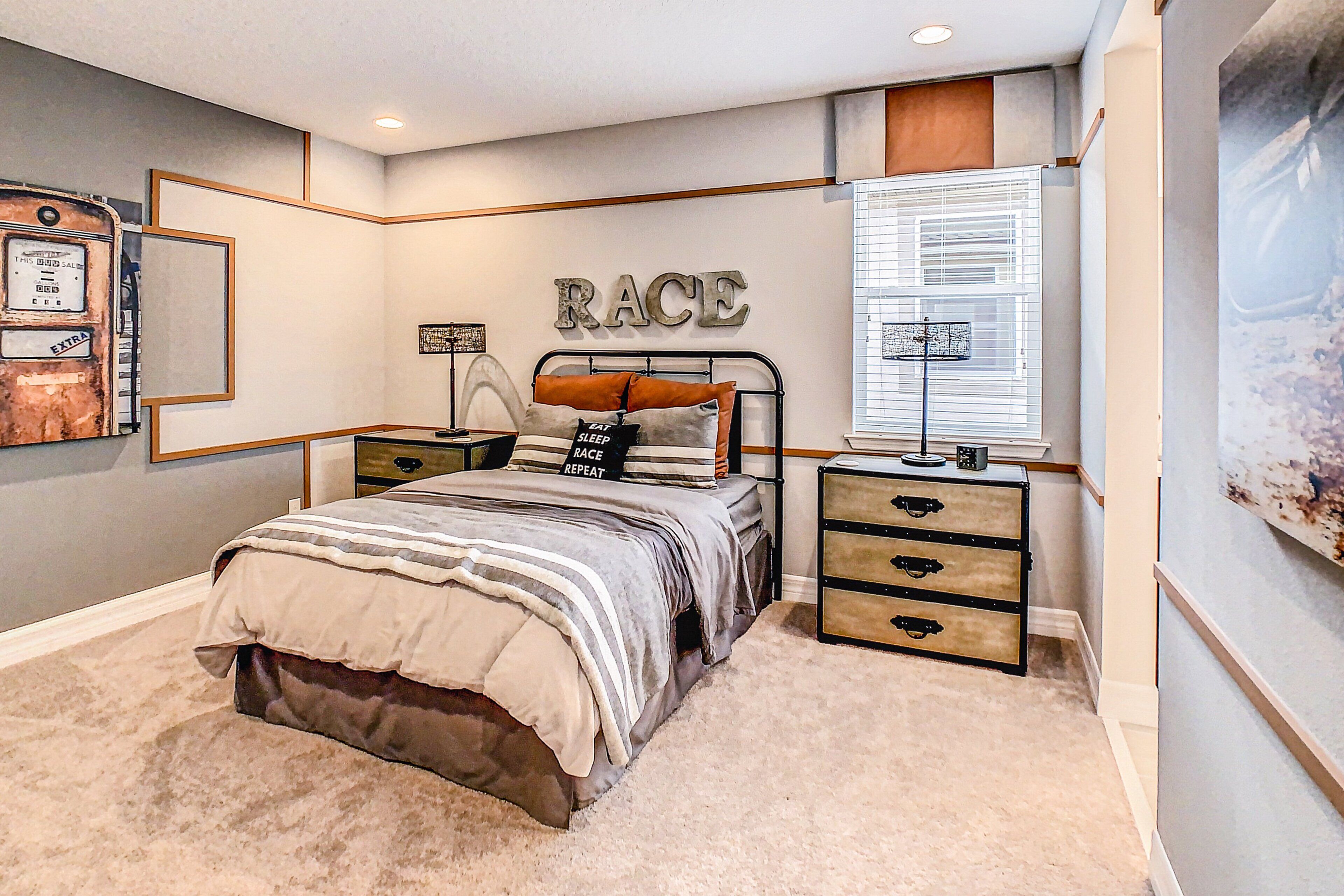 A bedroom with a bed, nightstands, a dresser, a wall-mounted artwork, and a window with blinds.