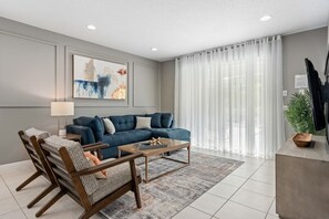 House, Multiple Beds, Pool Access, Pool View (Fantasy Family Escape-Encore Reunion) | Living area - Dog-friendly Getaway With Private Pool + Spa, Putting Green, Patio, & Game Room (Kissimmee)