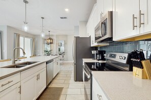 House, Multiple Beds, Pool Access, Pool View (Sunshine & Storybook Stays) | Private kitchen - Modern Townhouse With Private Pool, Resort Amenities, Themed Rooms and More (Kissimmee)