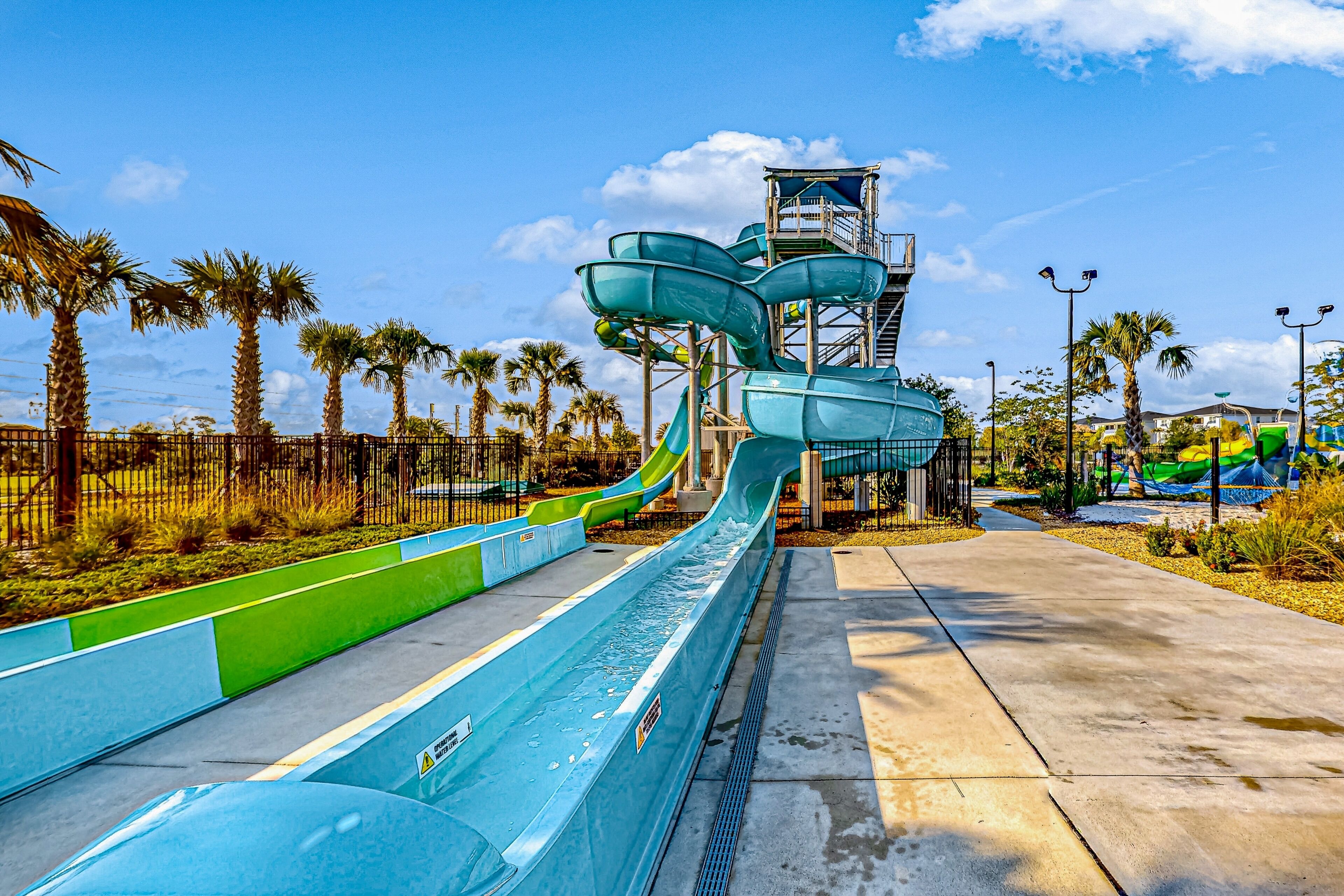 A water park with multiple water slides and a central tower structure.