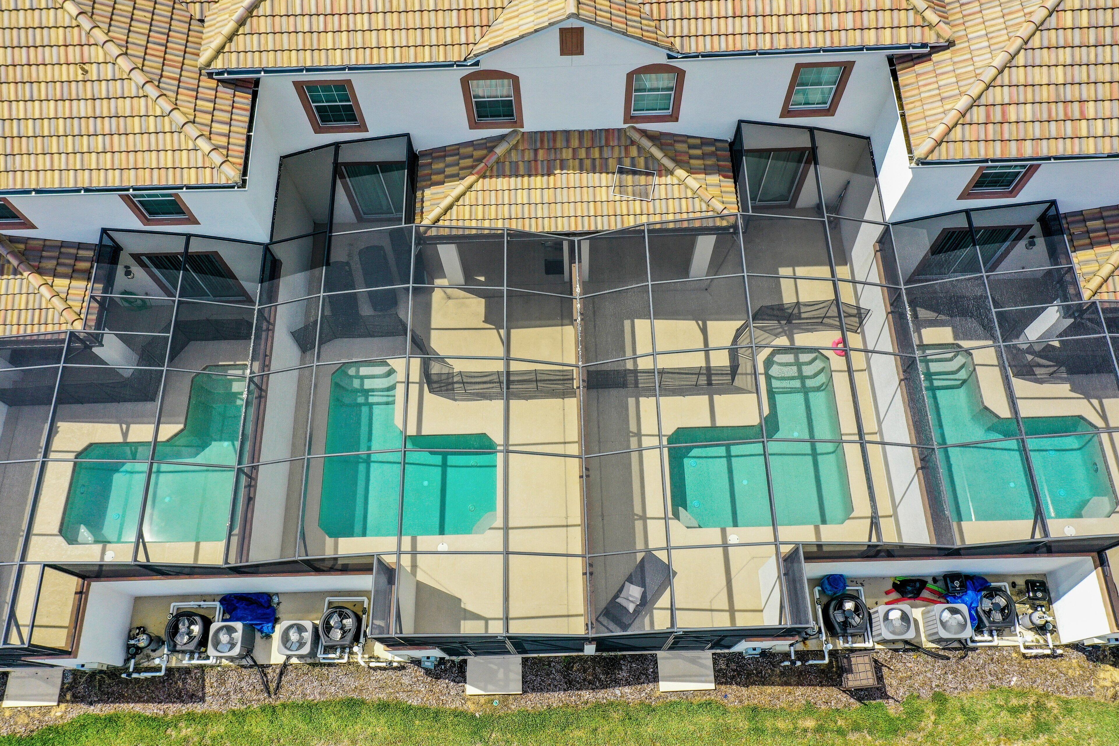 A modern building with a unique architectural design, featuring multiple levels and a glass facade.