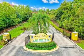 Front of property - Two-story, Dog-friendly gem Near Theme Parks With Pool, Central AC & On-site gym (Kissimmee)