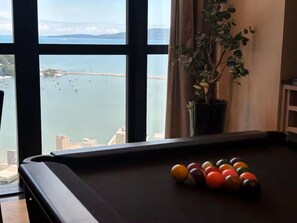 Games room - Apartment with gym, terrace, pool and sea view. (Itapema)