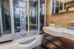 Shower, hair dryer, towels, shampoo