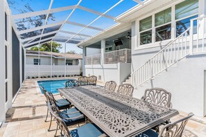 Outdoor dining - Honeysuckle Waterfront Home | Heated Pool, Creek Views, 3BR Retreat Near Beach (Largo)
