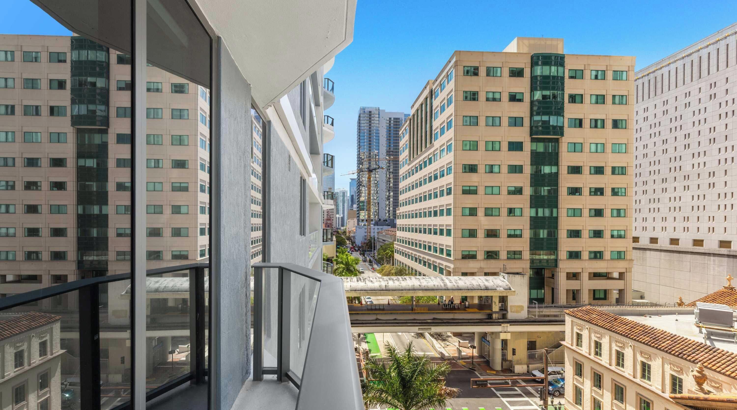 A high-rise building with multiple floors, large windows, and a modern architectural design.