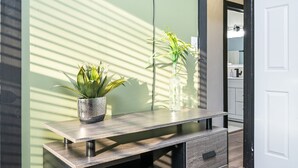 A modern bathroom with a mirror, a sink, and a toilet. - 5BR/3BA Stylish Modern Home in Decatur (Decatur)