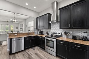 Fridge, microwave, oven, stovetop - Reflections Manor at Reunion | Stay in style at 5-bedroom villa in Orlando Near Disney (Kissimmee)