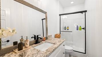 Shower, towels, soap, toilet paper