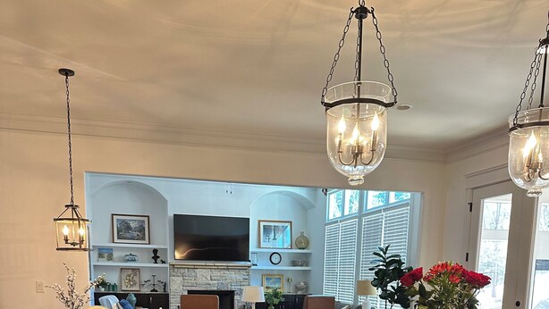A spacious kitchen with a large island, wooden flooring, and modern appliances. - FIFA World CUP -Spacious 4 bedroom house with Pool Table and Gym (Marietta)
