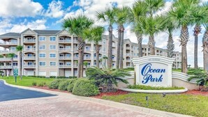 A multi-story hotel with a sign reading 'Ocean Park.' - Coastal Condo Oasis | Walk to Beach (Fernandina Beach)
