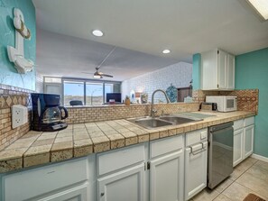 Fridge, microwave, oven, stovetop - Beachfront 2BR condo with pool, patio, WiFi, and dune views. (Port Aransas)
