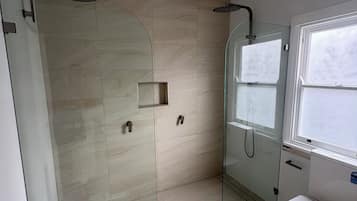 Shower, hair dryer, towels, soap