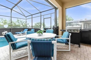 Outdoor dining - 7BR Disney Villa~2mi to Walt Disney World ~ Pool/Spa ~ Game Room ~ Resort Access (Kissimmee)