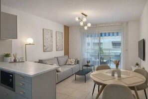 Living area - Modern 1BR · Pool, Parking & Walk to Beach (Cannes)