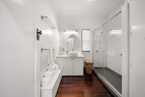 Shower, hair dryer, towels, shampoo
