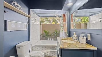 Shower, hair dryer, towels, shampoo