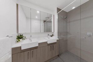 Shower, towels, shampoo - Freshly Built 2 Bed Apartment in Central Location (Cannington)