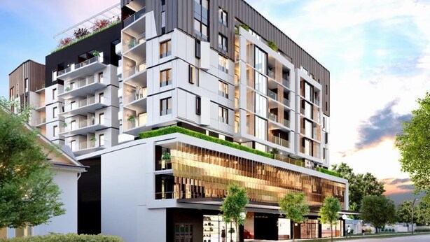 A multi-story building with balconies, a ground-level commercial area, and a modern architectural design. - Bright Newly 2 Bed Apartment with Balcony Views (Cannington)