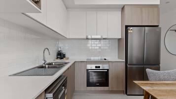 Coffee/tea maker, fridge, microwave, oven