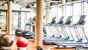 A gym with treadmills, weight plates, and exercise balls. - Student Only Studio Chapter Lewisham (London)