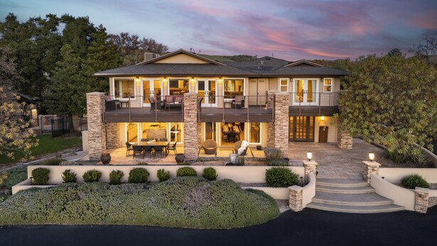 A two-story house with a balcony, a patio, and a well-maintained garden. - Sleeps 18, 2 Homes | Vineyard Estate + Pool + Hot Tub | Minutes to Templeton (Templeton)