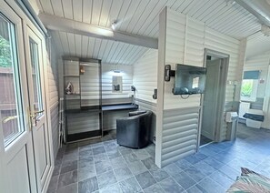 A compact kitchen with a sink, a countertop, and a black trash bin. - 0 bedroom accommodation in Brecon Beacons National Park, (Brecon Beacons National Park,)
