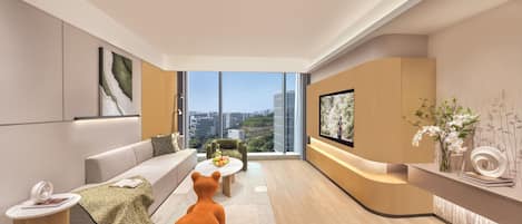 A modern living room with a sofa, a coffee table, a bear-shaped chair, and a TV.