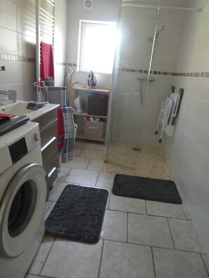 Shower, hair dryer, towels, toilet paper