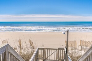 A wooden staircase leading to a beach with a clear view of the ocean. - Whittington - Oceanfront 3-Bedroom, perfect for family getaways! (North Topsail Beach)