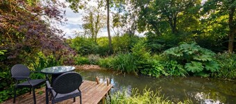 Tranquil cottage stay with fireplace and pond
