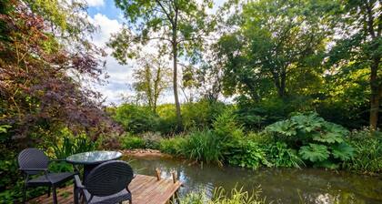 Tranquil cottage stay with fireplace and pond