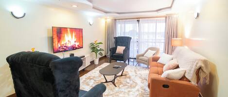 Departamento familiar, vista a la ciudad | Área de sala de estar