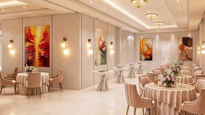 A spacious hotel dining area with round tables, elegant chairs, and modern decor. - Palette Convention Hotel Millennium (Gurugram)