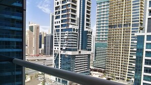 A high-rise building with a modern architectural design, large windows, and a view of a cityscape. - Dubai gate-2 (Dubai)