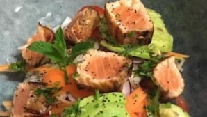 A bowl of food with salmon, avocado, and vegetables. - LE RELAIS DE LA FORGE (Selonnet)