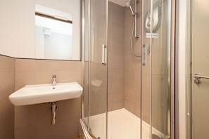 Shower, towels, soap, toilet paper