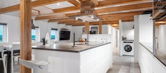 16-person holiday home with view over the water and wilderness bath.