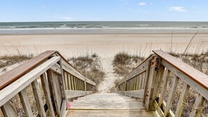 A wooden boardwalk leading to a beach with a clear view of the ocean. - Livin' On A Prayer - Charming 3 bedroom oceanfront cottage (North Topsail Beach)