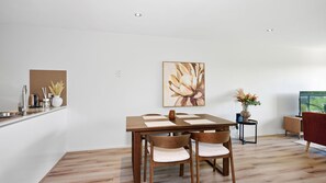 A modern kitchen with a sink, toaster, and decorative plants. - Hawthorn Haven  Balcony Views & Comfort (Hawthorn)