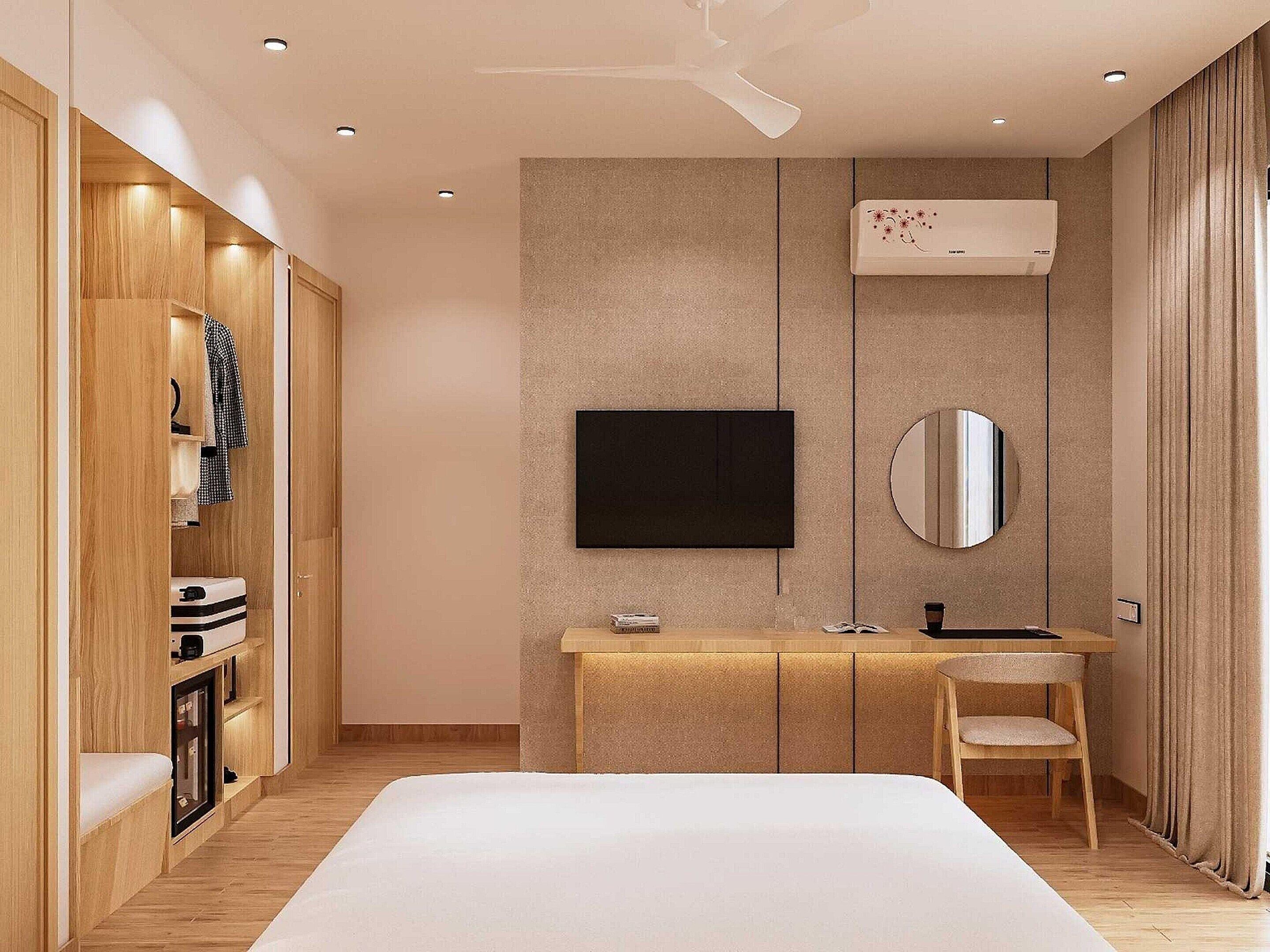 A modern bedroom with a bed, a TV, a mirror, a vanity, and a wardrobe.
