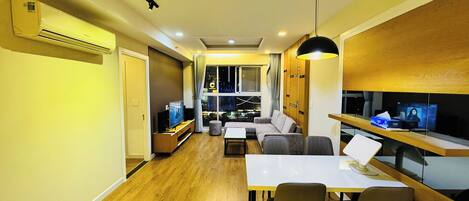 Family Apartment, 2 Bedrooms, City View | Living area | 55-inch Smart TV with satellite channels