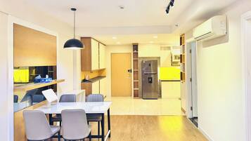 Family Apartment, 2 Bedrooms, City View | Living area | 55-inch Smart TV with satellite channels
