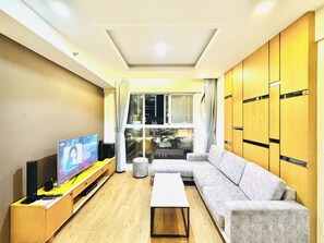 Family Apartment, 2 Bedrooms, City View | Living area | 55-inch Smart TV with satellite channels - Scenic Valley 2 EmHouse (Ho Chi Minh City)