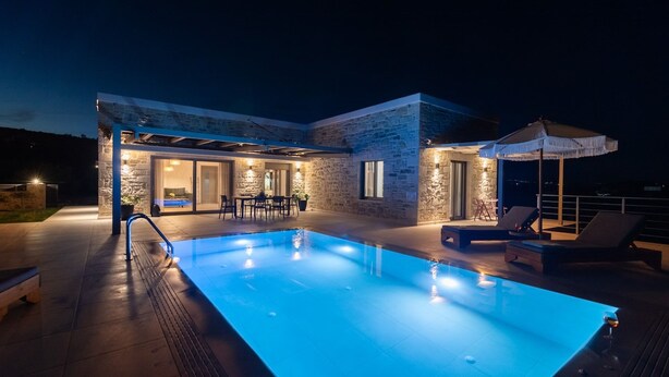 A modern house with a swimming pool, outdoor seating, and a covered patio area. - Ramo Dolivo Villa With Private Pool (Faistos)