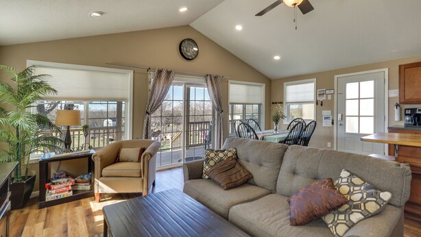 A spacious living room with a sofa, coffee table, and a ceiling fan. - Fish, Play & Explore! Family Gem in Rural Richland (Richland)